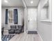 Bright entryway featuring wood-look floors and modern decor at 7884 Patagonia Point Ct, Las Vegas, NV 89179