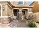 Charming front entrance with stone accents and arched entryway at 7884 Patagonia Point Ct, Las Vegas, NV 89179