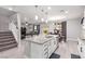 Bright kitchen with an island, stainless steel appliances, and seamless open layout at 7884 Patagonia Point Ct, Las Vegas, NV 89179