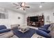Comfortable living room with a large entertainment center and plush seating at 7884 Patagonia Point Ct, Las Vegas, NV 89179