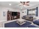 Cozy living room with media center and modern furnishings at 7884 Patagonia Point Ct, Las Vegas, NV 89179