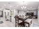 Open-concept design showcasing the kitchen, dining area, and living space at 7884 Patagonia Point Ct, Las Vegas, NV 89179