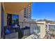 Relaxing balcony features comfortable seating and views of the surrounding area at 8255 Las Vegas Blvd # 313, Las Vegas, NV 89123
