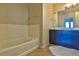 Clean bathroom featuring a bathtub and a vanity with ample counter space at 8255 Las Vegas Blvd # 313, Las Vegas, NV 89123