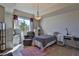 Comfortable bedroom with a twin bed, cozy chair, and a large window offering natural light and outdoor views at 8255 Las Vegas Blvd # 313, Las Vegas, NV 89123