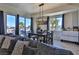Dining area with large windows, comfortable sofa, and view to balcony and landscape at 8255 Las Vegas Blvd # 313, Las Vegas, NV 89123