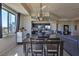 Open-concept dining room and kitchen area, featuring modern lighting and stainless steel appliances at 8255 Las Vegas Blvd # 313, Las Vegas, NV 89123
