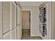Hallway with closet and view to bathroom featuring well-organized storage at 8255 Las Vegas Blvd # 313, Las Vegas, NV 89123