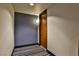 Hallway with neutral walls, plush carpets, and elegant wooden door at 8255 Las Vegas Blvd # 313, Las Vegas, NV 89123