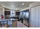 Modern kitchen features sleek stainless steel appliances and dark wood cabinets at 8255 Las Vegas Blvd # 313, Las Vegas, NV 89123