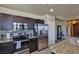 Updated kitchen featuring stainless steel appliances, modern backsplash, and granite countertops at 8255 Las Vegas Blvd # 313, Las Vegas, NV 89123