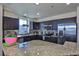 Modern kitchen with stainless steel appliances, granite countertops, and dark wood cabinets at 8255 Las Vegas Blvd # 313, Las Vegas, NV 89123