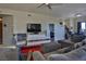 Spacious living room with comfortable seating, modern TV setup, and a ceiling fan, perfect for relaxation and entertainment at 8255 Las Vegas Blvd # 313, Las Vegas, NV 89123