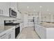 Bright kitchen showcasing granite counters, stainless steel appliances, and modern cabinetry at 8994 Pacific Mist St, Las Vegas, NV 89178