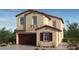 Charming two-story home featuring a brown garage door and a covered porch at 97 Tardando Ave, Henderson, NV 89015