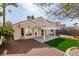 A beautiful backyard featuring desert landscaping, artificial turf, and covered patio at 9808 Eagle Rock Ct, Las Vegas, NV 89117