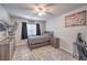 Relaxing bedroom with a bed, dresser, TV, and an accent rug at 9876 Parador Cellars Ct, Las Vegas, NV 89141