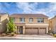 Charming two-story home with a terracotta roof and a spacious three-car garage at 9876 Parador Cellars Ct, Las Vegas, NV 89141