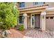 Inviting entryway with well-manicured landscaping, stone accents, and stylish lighting enhancing curb appeal at 9876 Parador Cellars Ct, Las Vegas, NV 89141
