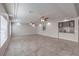 Spacious living room with recessed lighting, ceiling fans, and an open layout into kitchen area at 9876 Parador Cellars Ct, Las Vegas, NV 89141