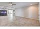 Open-concept living room with neutral tile flooring, recessed lighting, and a built-in aquarium at 9876 Parador Cellars Ct, Las Vegas, NV 89141