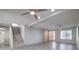 Bright living room featuring neutral tile flooring, recessed lighting, and staircase at 9876 Parador Cellars Ct, Las Vegas, NV 89141