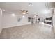 Expansive living room with recessed lights, ceiling fans, and an open floor plan flowing into the kitchen at 9876 Parador Cellars Ct, Las Vegas, NV 89141