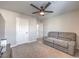 Relaxing living room with a gray sofa and a view of interior doors at 9876 Parador Cellars Ct, Las Vegas, NV 89141