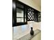 Cozy pass-through from an adjacent room complete with granite counter and decorative cabinet at 9876 Parador Cellars Ct, Las Vegas, NV 89141