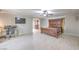 Spacious main bedroom featuring wood-look tile floor and ceiling fan at 9876 Parador Cellars Ct, Las Vegas, NV 89141