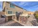 Outdoor kitchen with a built-in brick grill and countertop space, perfect for entertaining at 9876 Parador Cellars Ct, Las Vegas, NV 89141
