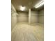 Spacious walk-in closet with ample shelving and wood-look tile flooring at 9876 Parador Cellars Ct, Las Vegas, NV 89141