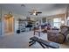 Inviting living room with entertainment center and a ceiling fan at 9935 Fletcher Peak Ave, Las Vegas, NV 89178