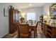 Elegant dining room features wood furnishings and lovely decor, perfect for Gathering gatherings at 10217 Queens Church Ave, Las Vegas, NV 89135