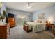 Serene main bedroom with carpet, neutral tones, ample natural light, and ceiling fan at 10217 Queens Church Ave, Las Vegas, NV 89135