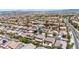Expansive aerial view of a well-planned community with lush landscaping and consistent architecture at 10662 Bonchester Hill St, Las Vegas, NV 89141
