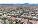 Wide aerial shot showcasing a densely populated residential area with mountain views in the distance at 10662 Bonchester Hill St, Las Vegas, NV 89141