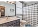 Bathroom featuring gray vanity, neutral paint, and shower with curtain at 10662 Bonchester Hill St, Las Vegas, NV 89141