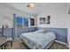 Calming bedroom with soft blue accents, bright natural light, and tranquil decor at 10662 Bonchester Hill St, Las Vegas, NV 89141