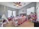 Cozy bedroom featuring plush decor, natural light, and a comfortable, inviting atmosphere at 10662 Bonchester Hill St, Las Vegas, NV 89141