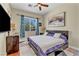 Well-lit bedroom with hardwood floors, contemporary decor, and modern furnishings at 10662 Bonchester Hill St, Las Vegas, NV 89141
