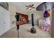 Versatile bonus room featuring built-in shelves, carpeted flooring, and ample space for a playroom or gym at 10662 Bonchester Hill St, Las Vegas, NV 89141