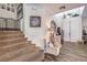 Inviting entryway with a neutral color palette, unique décor, and wood-look flooring at 10662 Bonchester Hill St, Las Vegas, NV 89141