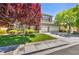 Charming two-story home featuring a well-maintained lawn, mature trees, and a three-car garage at 10662 Bonchester Hill St, Las Vegas, NV 89141