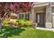 Charming home exterior with a 'Welcome' sign, mature landscaping, and a cozy entrance at 10662 Bonchester Hill St, Las Vegas, NV 89141