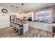 Modern kitchen with an island, granite countertops and stainless steel appliances at 10662 Bonchester Hill St, Las Vegas, NV 89141