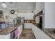 Stylish kitchen with granite counters, stainless steel appliances, wood-look flooring, and ample cabinet space at 10662 Bonchester Hill St, Las Vegas, NV 89141