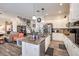Bright kitchen boasts granite countertops, wood floors, white cabinets, and stainless steel appliances at 10662 Bonchester Hill St, Las Vegas, NV 89141