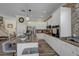 Modern kitchen with granite countertops, stainless appliances, and a breakfast bar, perfect for casual dining at 10662 Bonchester Hill St, Las Vegas, NV 89141