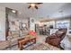 Spacious living room featuring hardwood floors and an open floor plan to the kitchen at 10662 Bonchester Hill St, Las Vegas, NV 89141